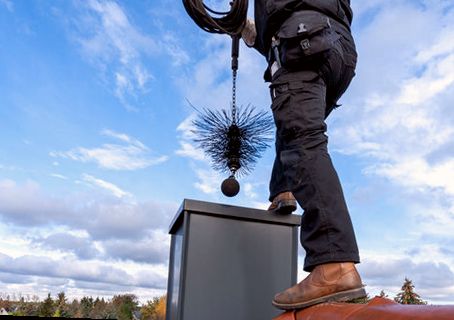 Weighted brush dropped down a chase flue